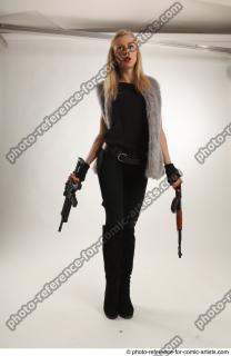 09 2018 01 NIKOL STANDING POSE WITH GUNS